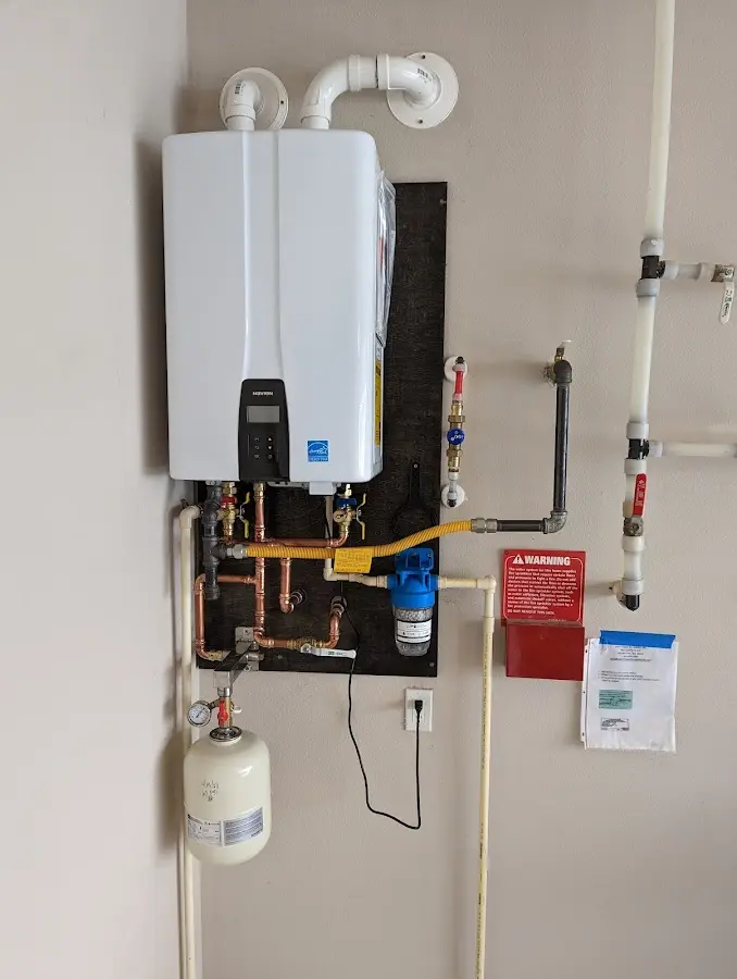 Professional plumber installing copper piping in a Avra Valley home